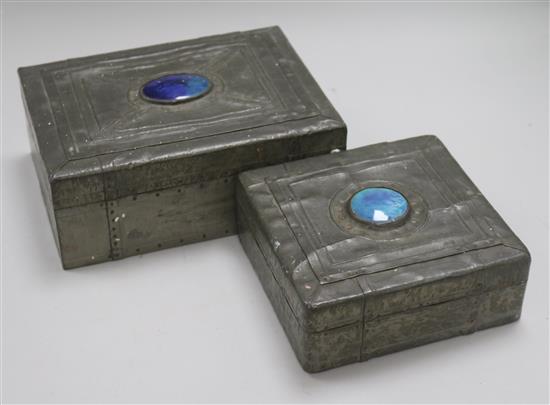 Two Arts & Crafts style pewter-covered wooden boxes, each with blue enamel oval cabochon to cover